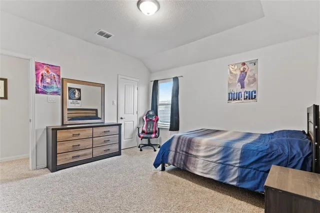 a close up of a white vase with flowers