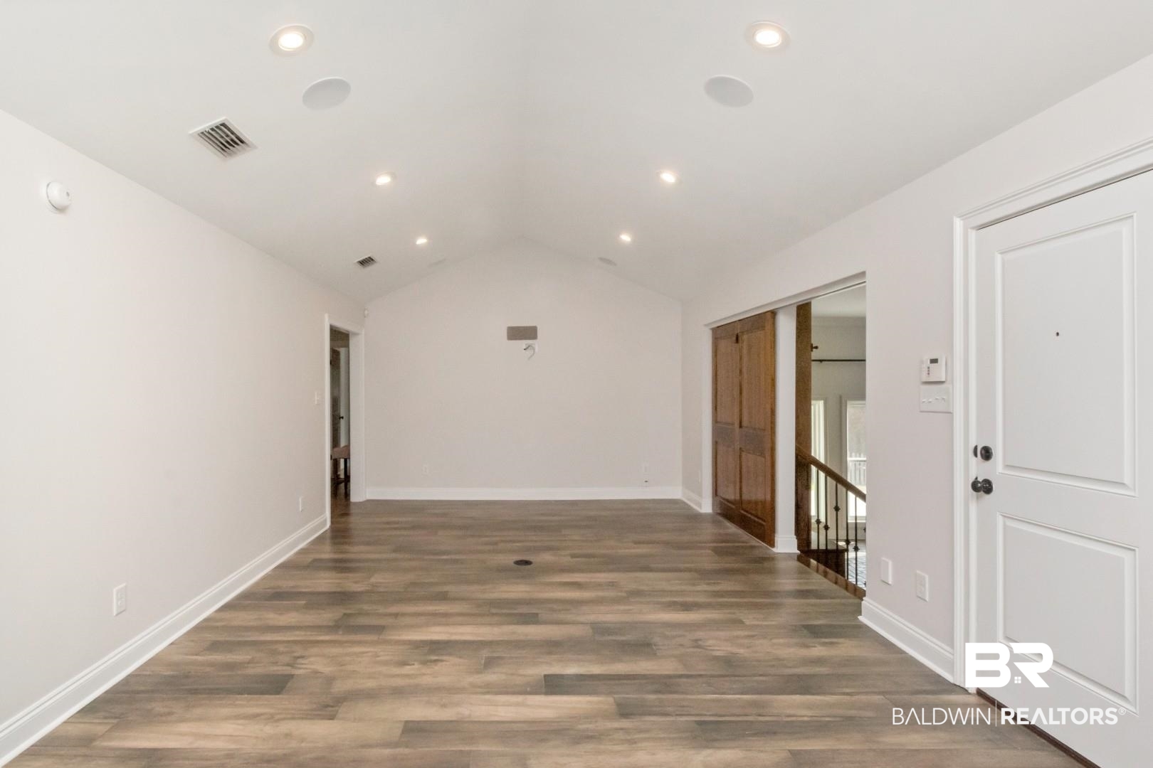 231 Rochester Road Mobile, AL 36608 - Photo 14 of 51 Empty room with dark wood-style floors and recessed lighting