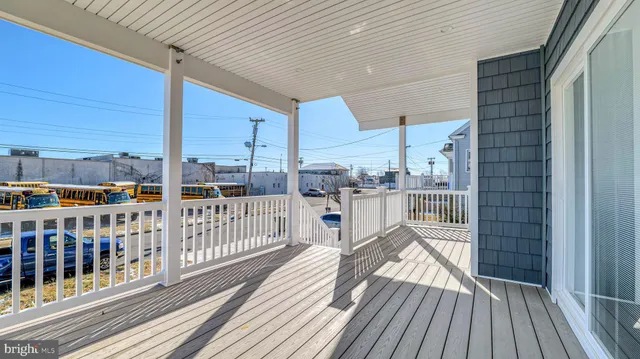 a view of a balcony with wooden floor