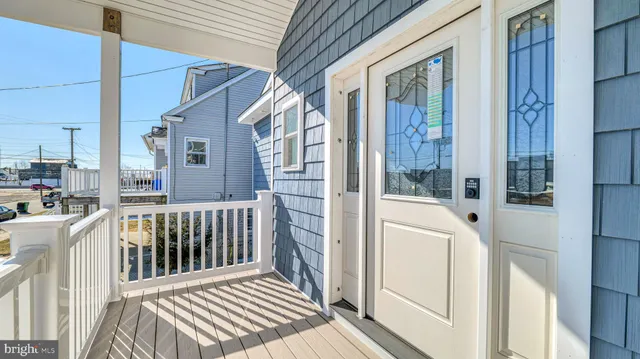 a view of a balcony with wooden floor
