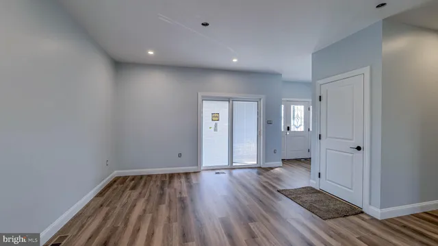 a view of a livingroom with wooden floor