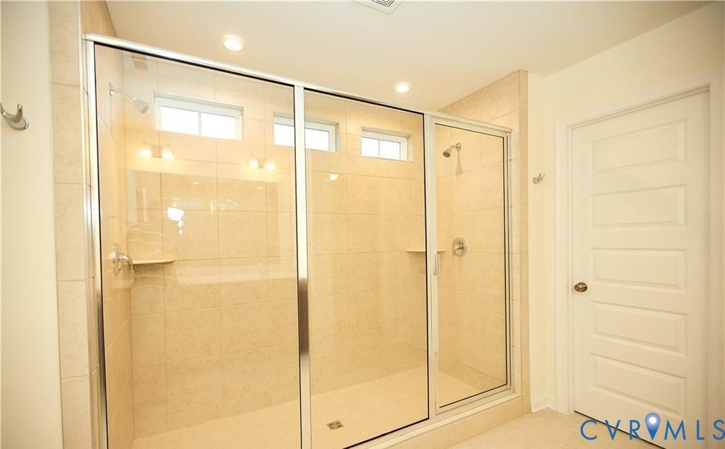 15513 Wolfboro Road Chesterfield, VA 23832 - Photo 11 of 23 a bathroom with a glass shower door