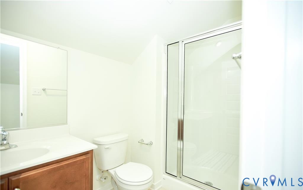15513 Wolfboro Road Chesterfield, VA 23832 - Photo 18 of 23 a bathroom with a shower a toilet and a sink