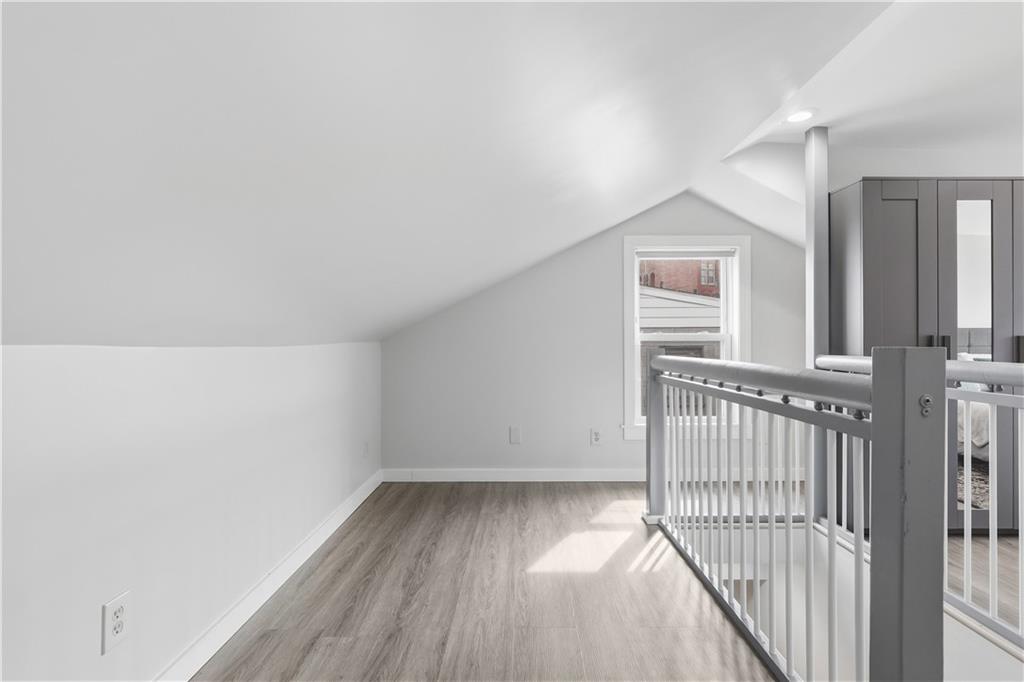 187 42nd Street Pittsburgh, PA 15201 - Photo 20 of 26 a view of a hallway with wooden floor and a window
