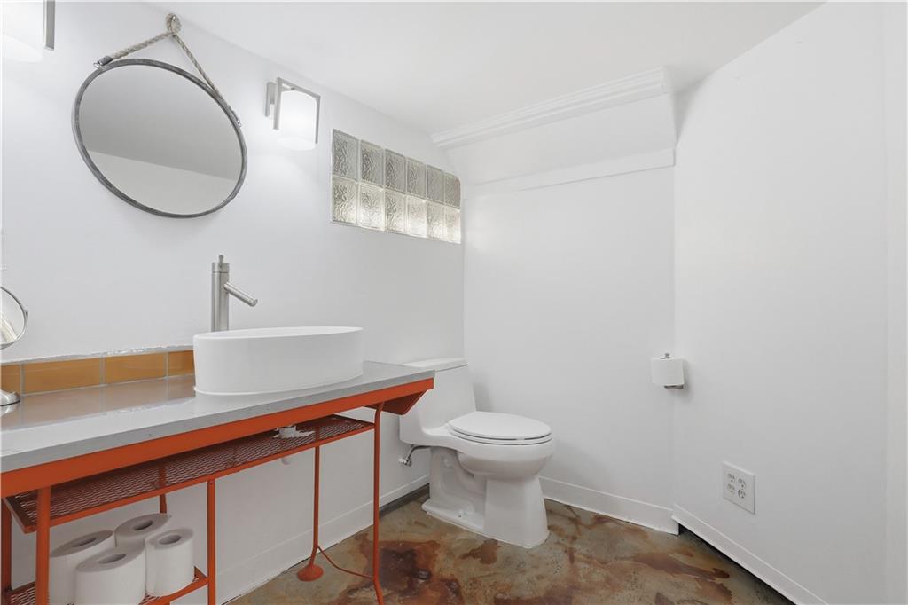 187 42nd Street Pittsburgh, PA 15201 - Photo 21 of 26 a bathroom with a sink a toilet and a mirror