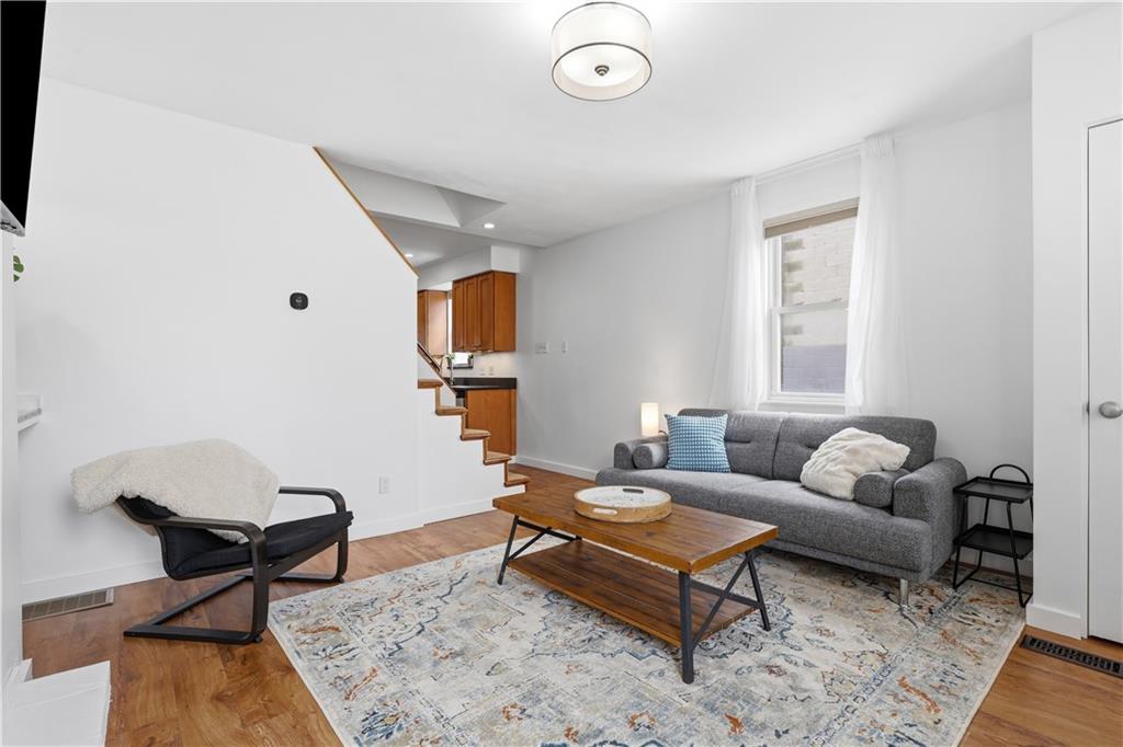 187 42nd Street Pittsburgh, PA 15201 - Photo 5 of 26 a living room with furniture a rug and a window
