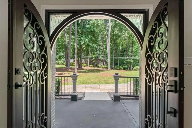 a view of entryway with wooden floor and stairs