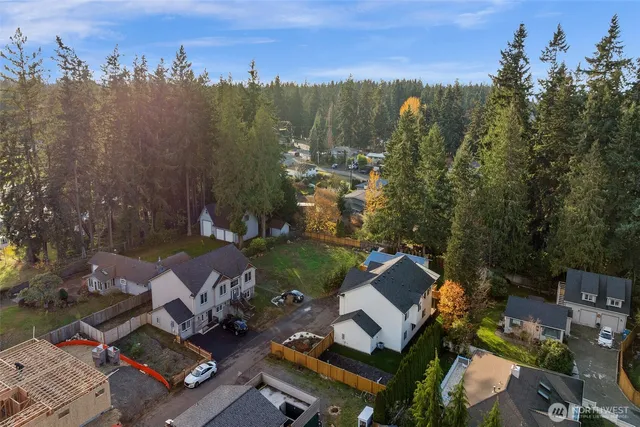 an aerial view of a house with a garden