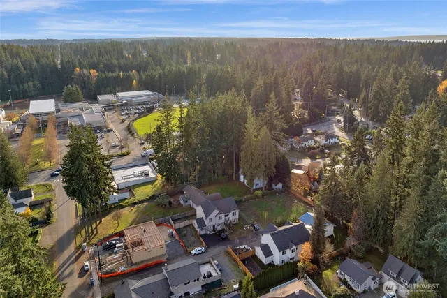 an aerial view of a house with a lake view
