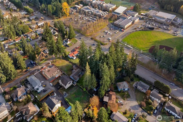 an aerial view of residential houses with outdoor space