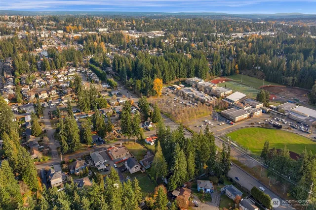 an aerial view of residential house with outdoor space and swimming pool