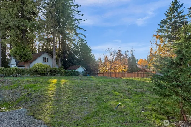 a swimming pool with trees in the background