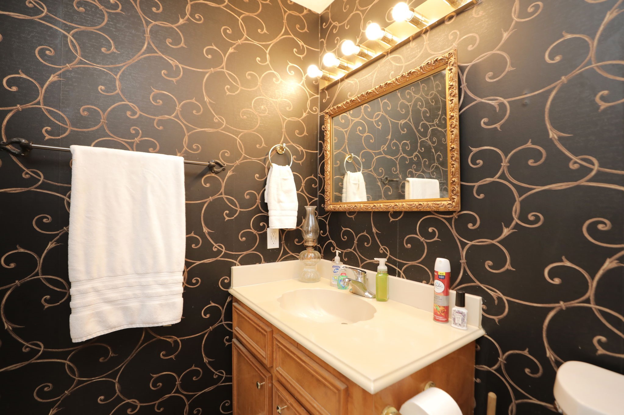 9810 Sugar Tree Court Houston, TX 77070 - Photo 21 of 30 a bathroom with a sink and a mirror