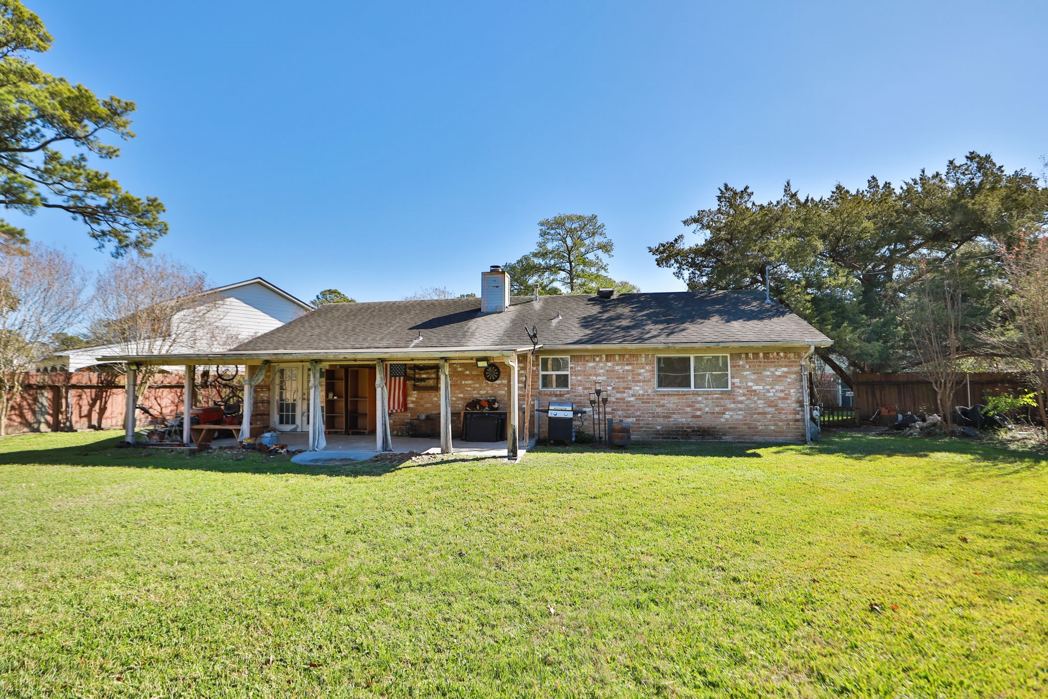 9810 Sugar Tree Court Houston, TX 77070 - Photo 25 of 30 a view of a house with a big yard and large trees