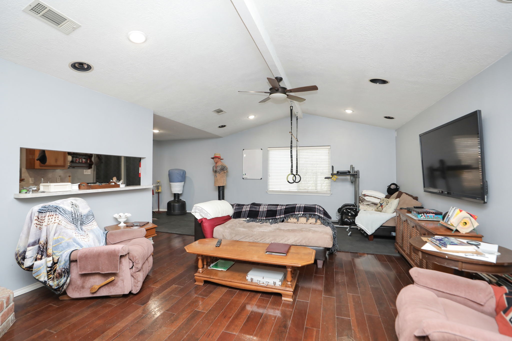 9810 Sugar Tree Court Houston, TX 77070 - Photo 4 of 30 a living room with furniture and a flat screen tv