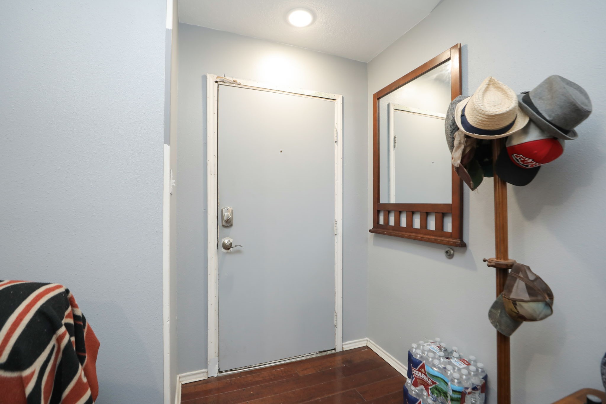 9810 Sugar Tree Court Houston, TX 77070 - Photo 5 of 30 a bedroom with a bed and cabinets