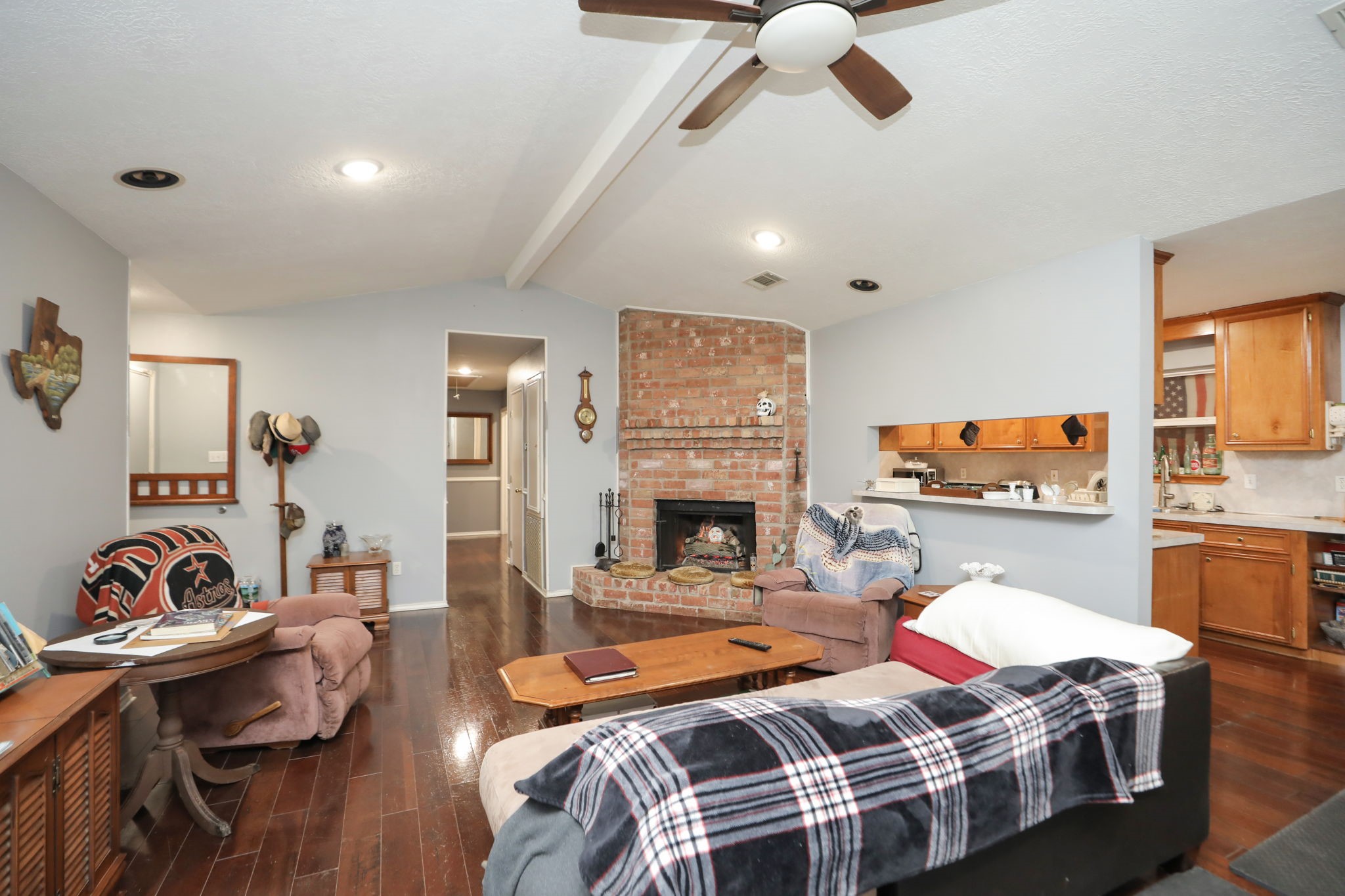 9810 Sugar Tree Court Houston, TX 77070 - Photo 7 of 30 a bedroom with furniture and a fireplace