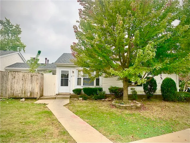 a house view with a garden space