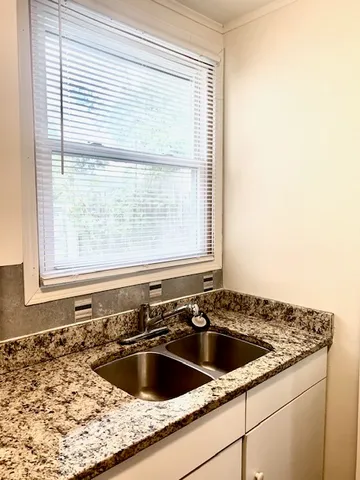 a view of a sink and a window