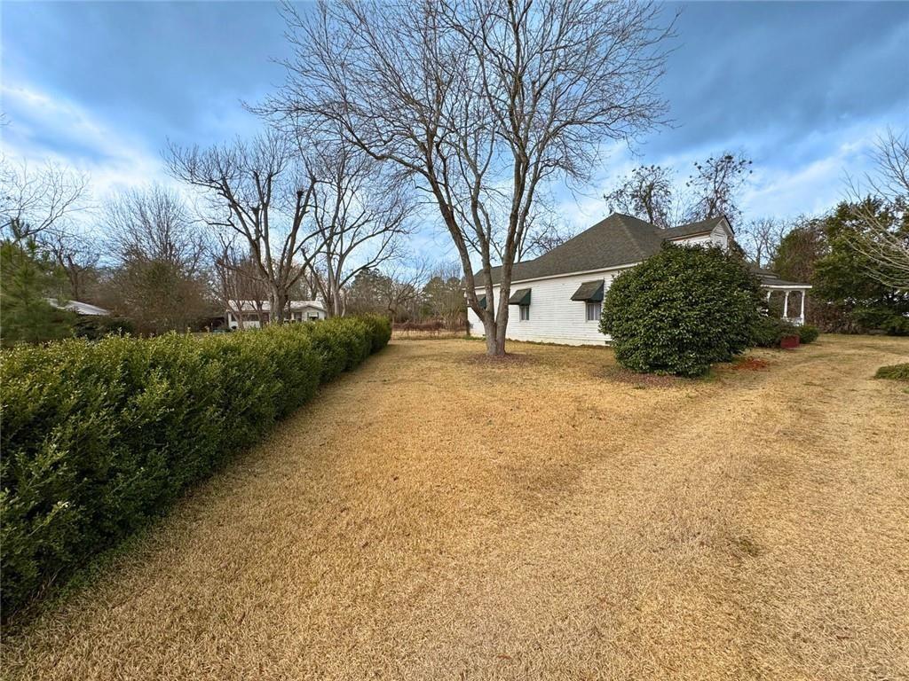 209 Old Perry Road Marshallville, GA 31057 - Photo 12 of 40 a view of a yard with trees