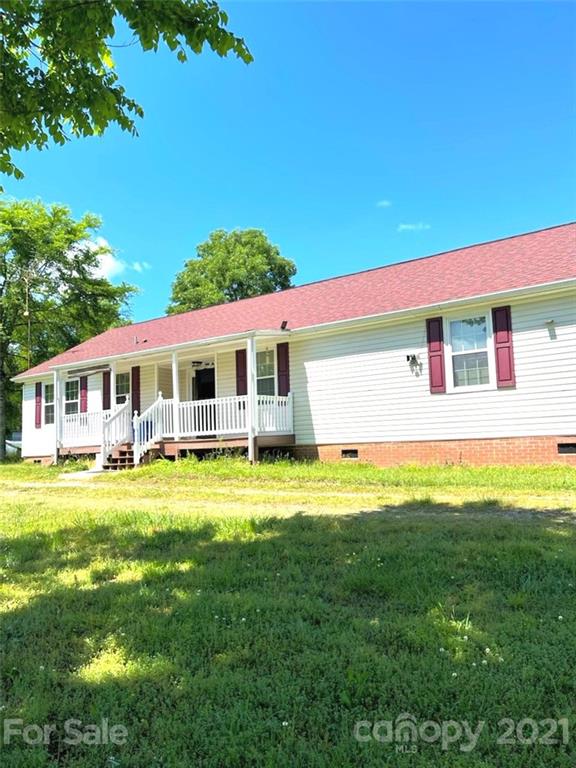 369 Cedar Grove Road Clover, SC 29710 - Photo 13 of 32 a front view of a house with a yard table and chairs