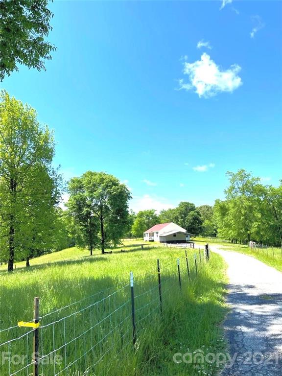 369 Cedar Grove Road Clover, SC 29710 - Photo 15 of 32 a view of a lake with a big yard