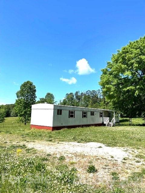 369 Cedar Grove Road Clover, SC 29710 - Photo 21 of 32 a view of a house with a big yard