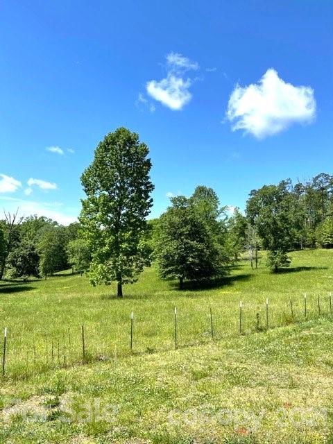 369 Cedar Grove Road Clover, SC 29710 - Photo 29 of 32 a view of a big yard with an outdoor space and seating