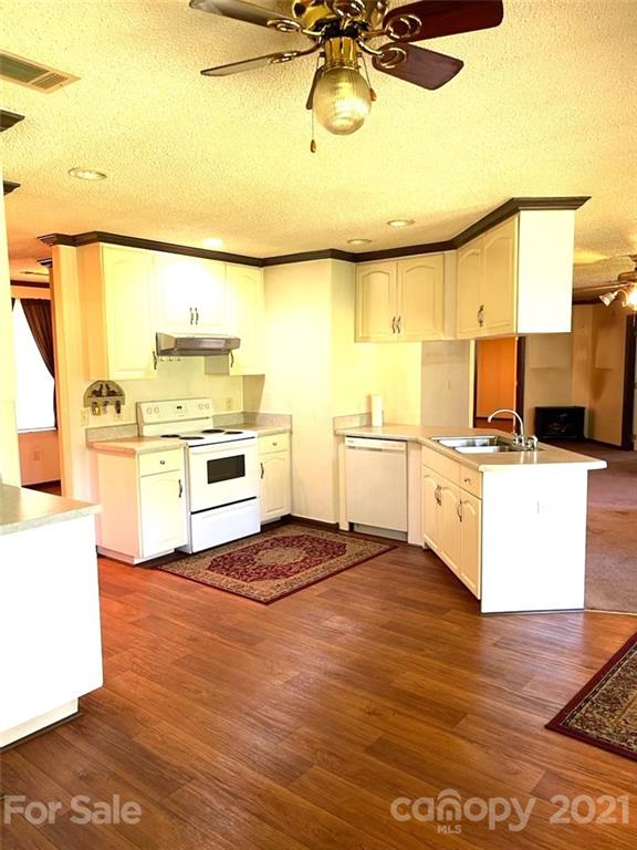 369 Cedar Grove Road Clover, SC 29710 - Photo 4 of 32 a kitchen with a sink appliances and cabinets
