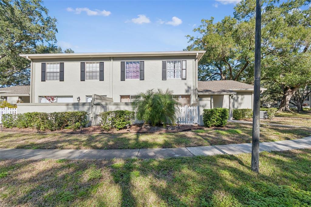 Undisclosed Address Temple Terrace, FL 33617 - Photo 5 of 23 a front view of a house with a yard