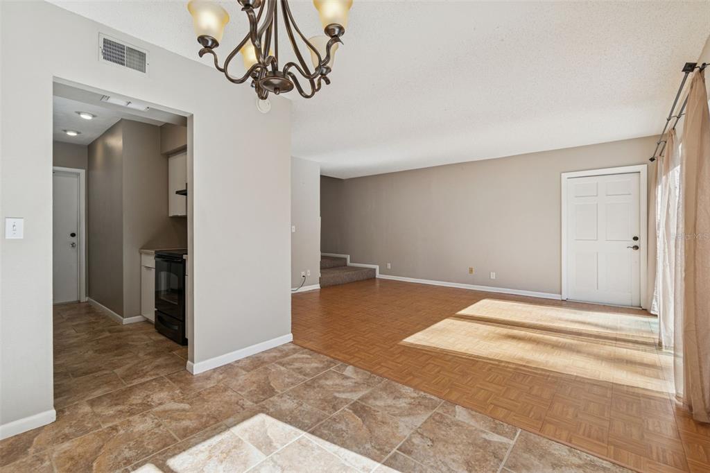 Undisclosed Address Temple Terrace, FL 33617 - Photo 9 of 23 a view of a livingroom with wooden floor and closet area