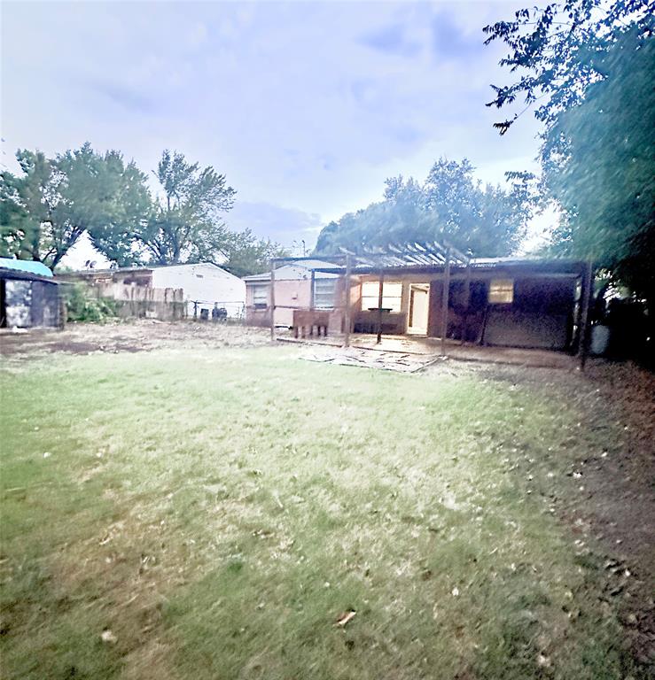 3036 Albany Drive Mesquite, TX 75150 - Photo 15 of 15 a view of a house with a yard and sitting area