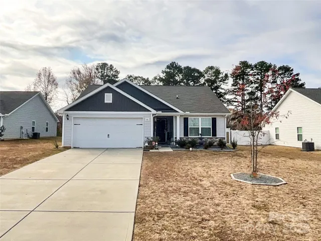 a view of a house with a snow in the background