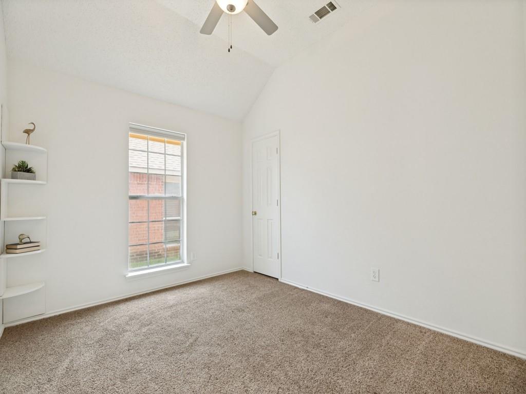7641 King Arthur Road Frisco, TX 75035 - Photo 9 of 16 Bright, airy bedroom showcasing vaulted ceilings, a ceiling fan, and neutral carpet flooring