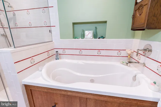 a view of living room with wooden floor and furniture