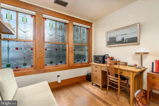 a balcony with table and chairs