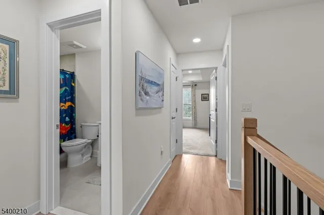 a view of hallway with livingroom and furniture