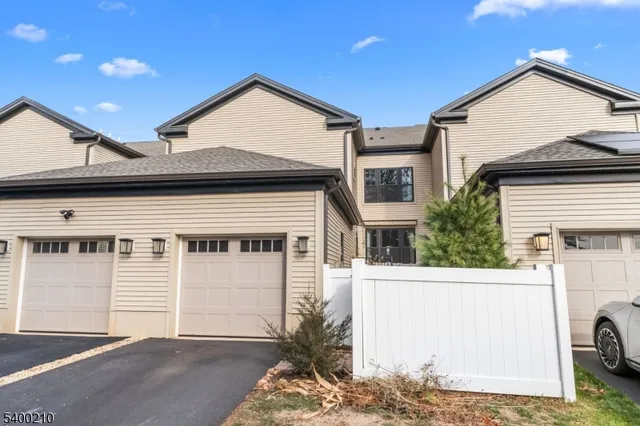 a front view of a house with a garage