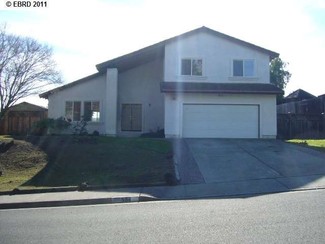 304 Iris Road Hercules, CA 94547 - Photo 1 of 1 a front view of a house with garage