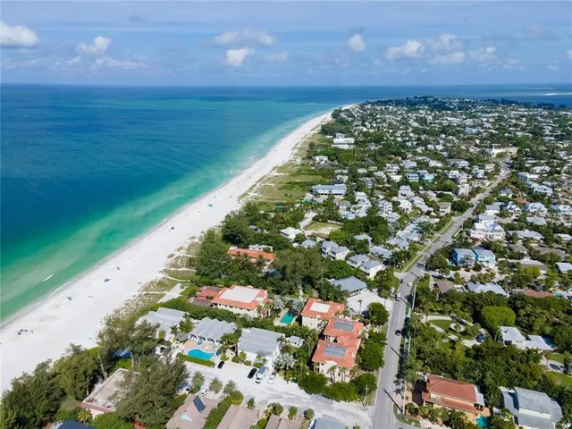 a view of hallway with a glass door shower