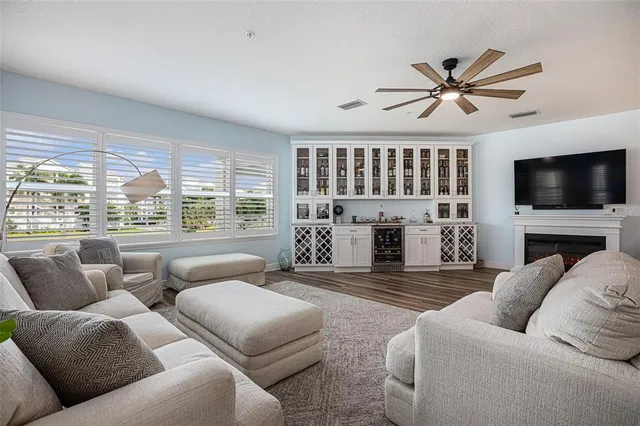 a living room with fireplace furniture and a flat screen tv