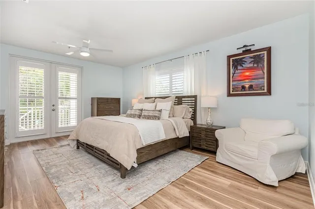 a spacious bedroom with a bed a couch and a window