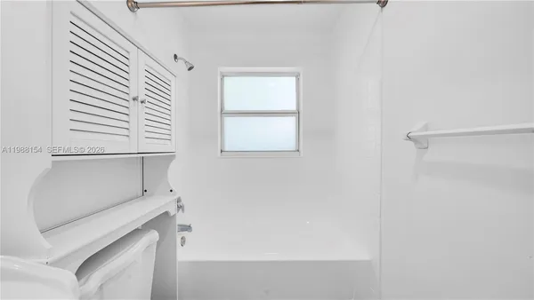 a view of storage and utility room with washer and dryer
