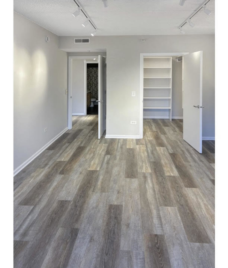 5 West Central Road, Unit 201 Mount Prospect, IL 60056 - Photo 5 of 14 a view of an empty room and window