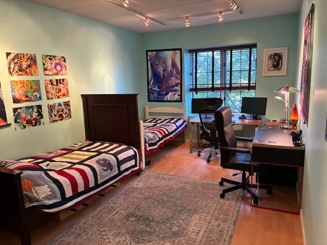 a bedroom with bed and a window