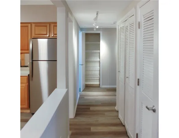 a view of a kitchen from the hallway