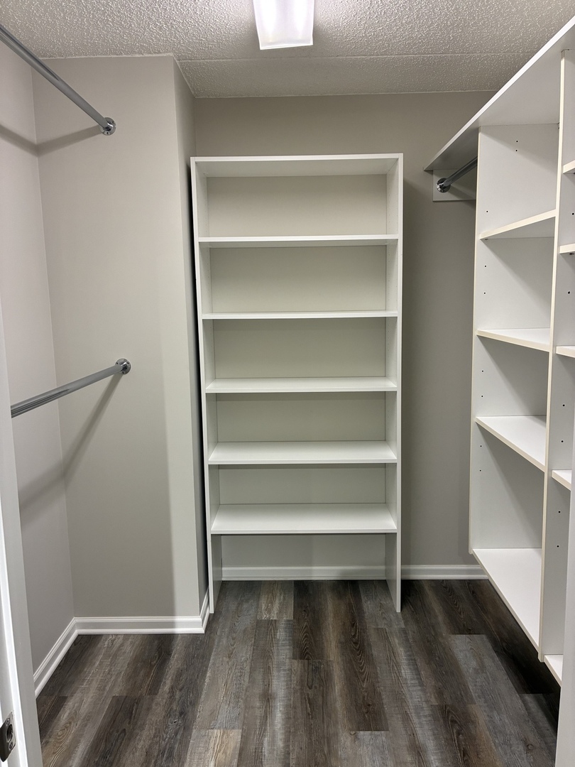 5 West Central Road, Unit 201 Mount Prospect, IL 60056 - Photo 9 of 14 a view of walk in closet with empty racks