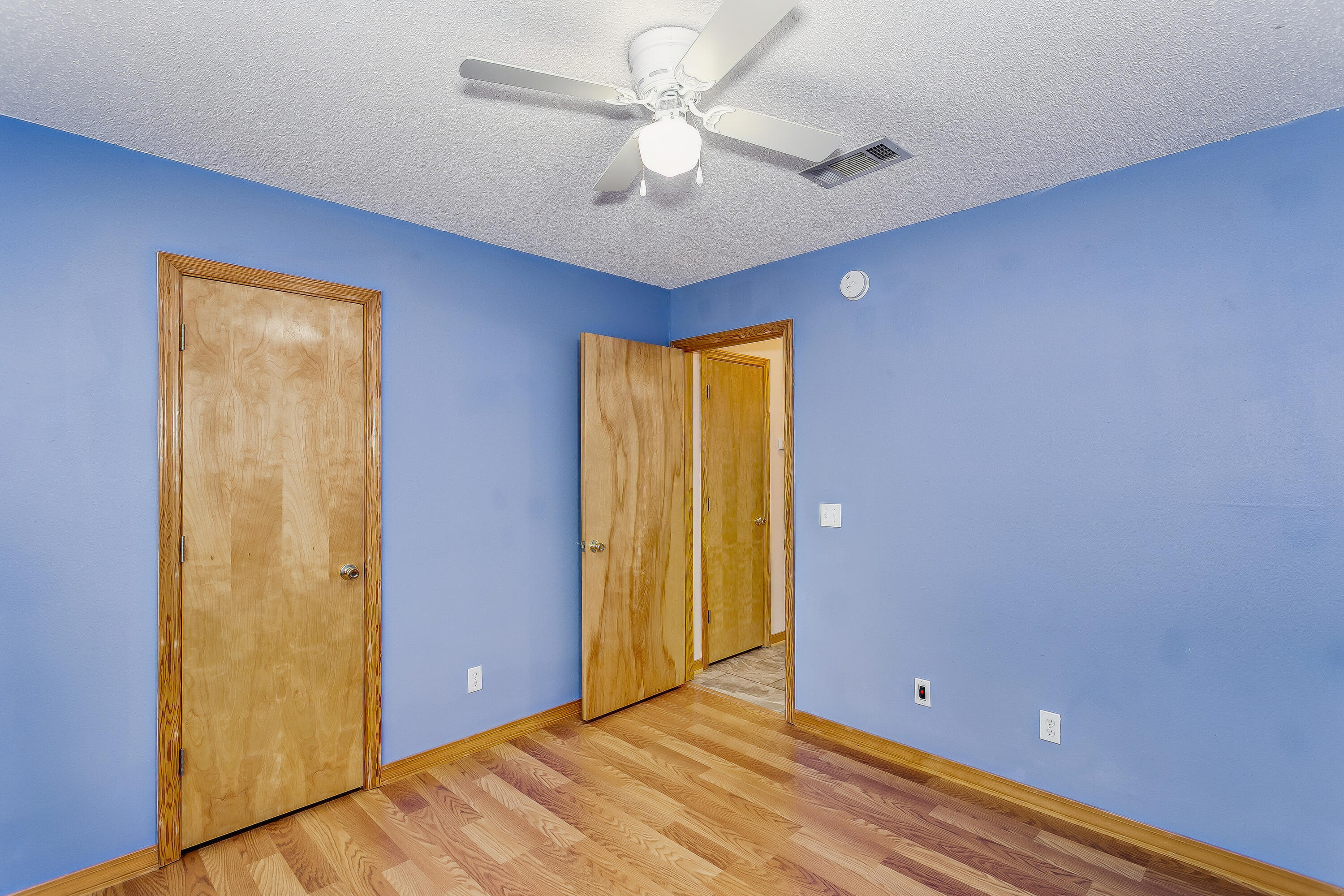 5360 Windham Road Milton, FL 32570 - Photo 17 of 27 a view of an empty room with window and a ceiling fan