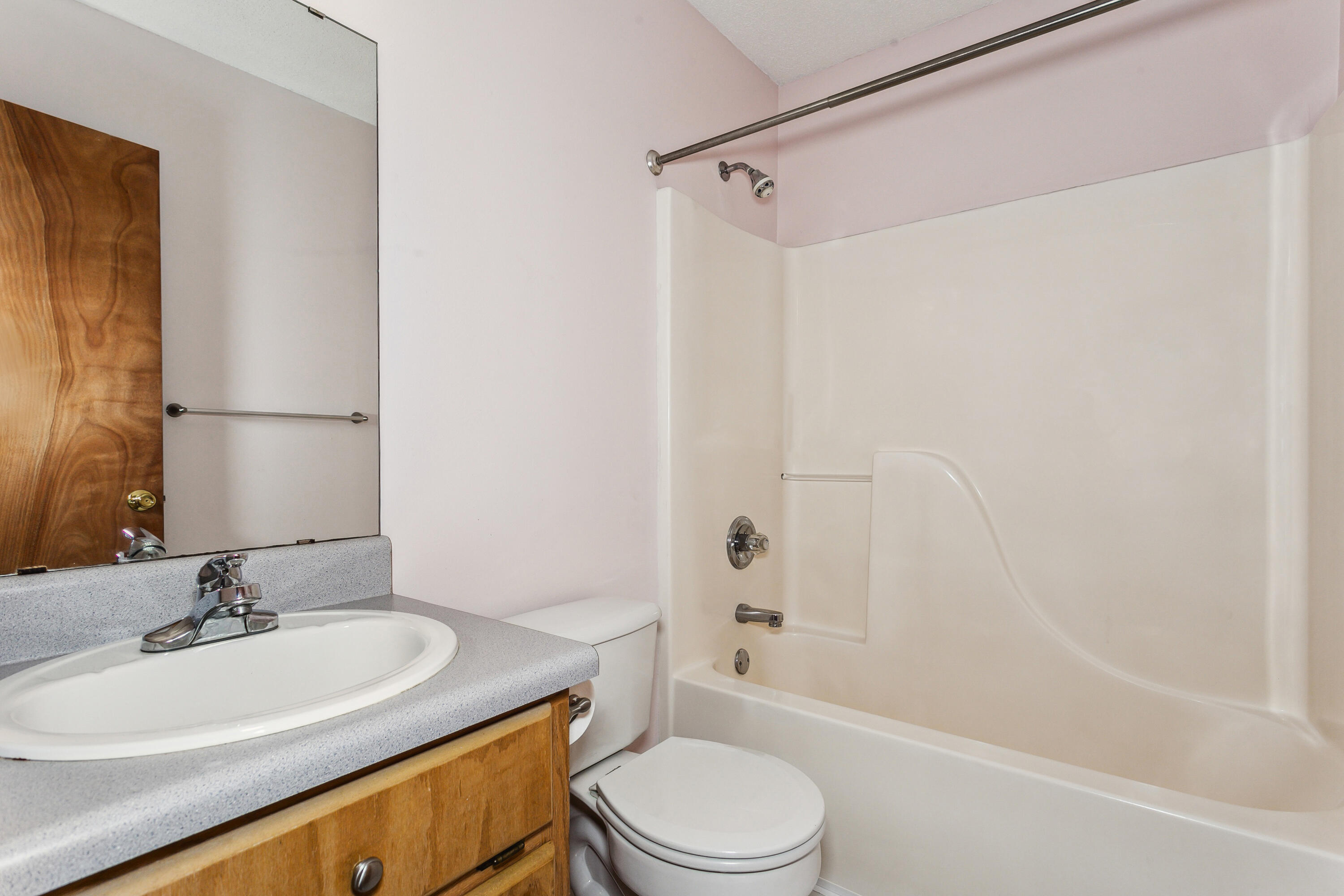 5360 Windham Road Milton, FL 32570 - Photo 20 of 27 a bathroom with a sink a toilet and a bathtub