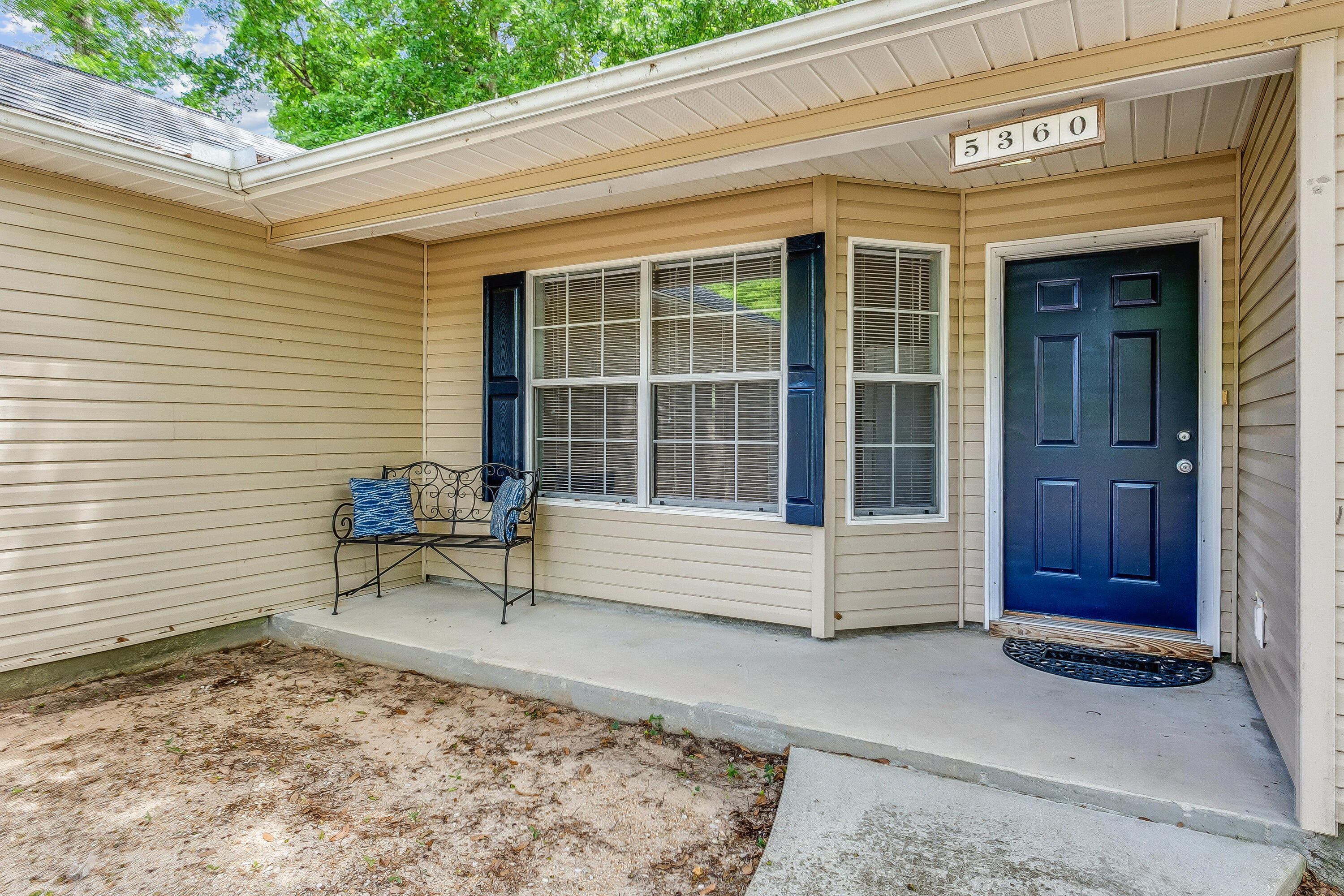 5360 Windham Road Milton, FL 32570 - Photo 3 of 27 a view of a bench in front of a window